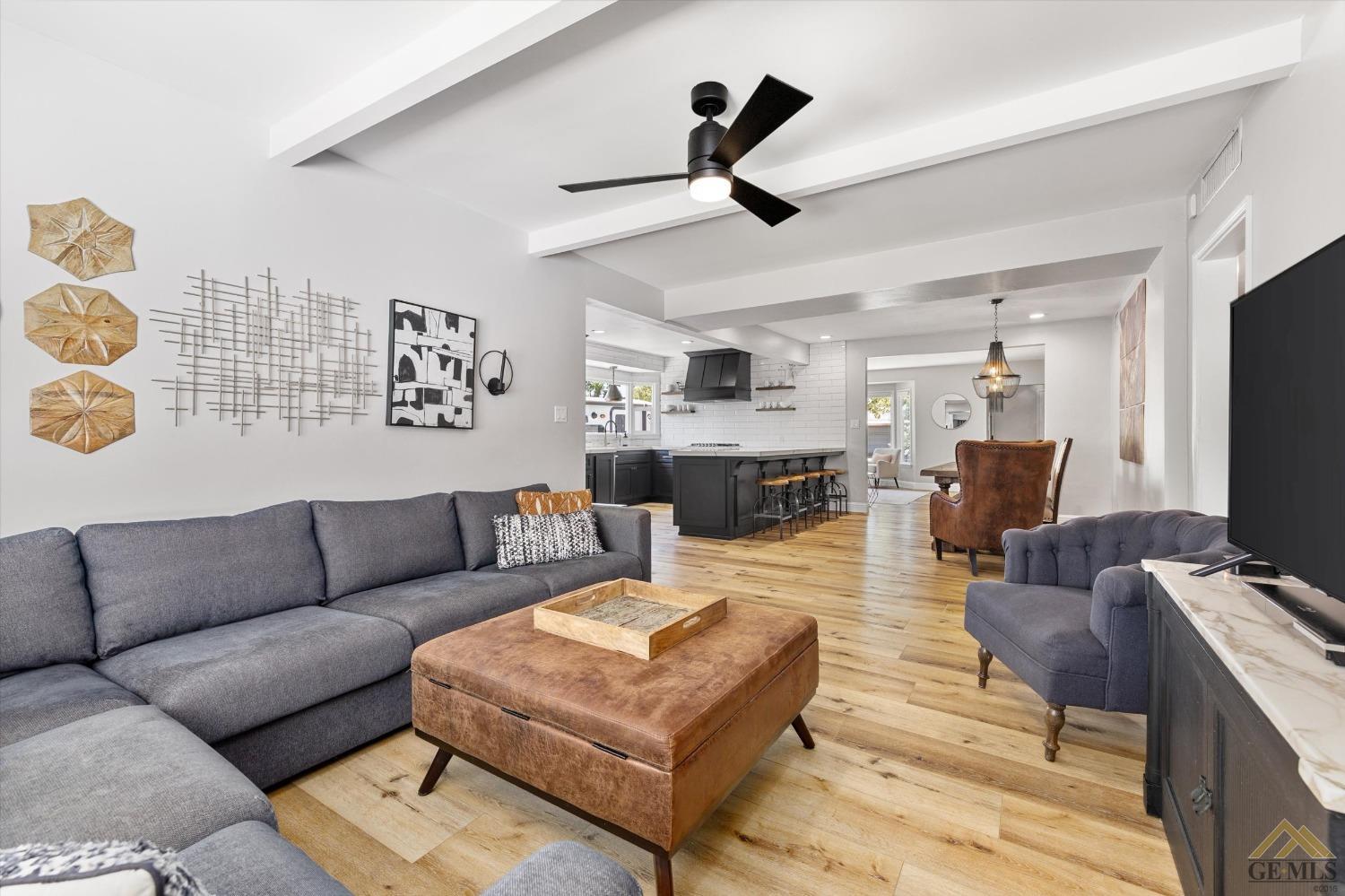 Undisclosed Address Bakersfield, CA 93305 - Photo 17 of 41 a living room with furniture and a flat screen tv