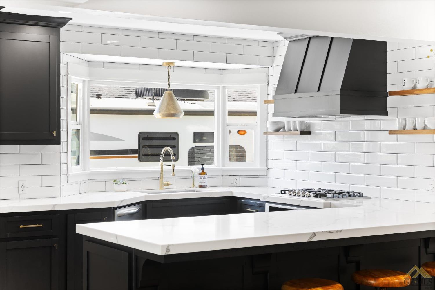 Undisclosed Address Bakersfield, CA 93305 - Photo 19 of 41 a kitchen with a sink and a refrigerator