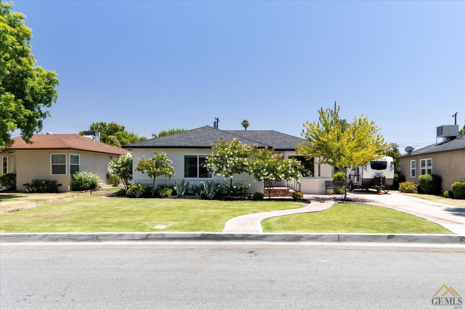 Undisclosed Address Bakersfield, CA 93305 - Photo 2 of 41 a view of a house with a swimming pool