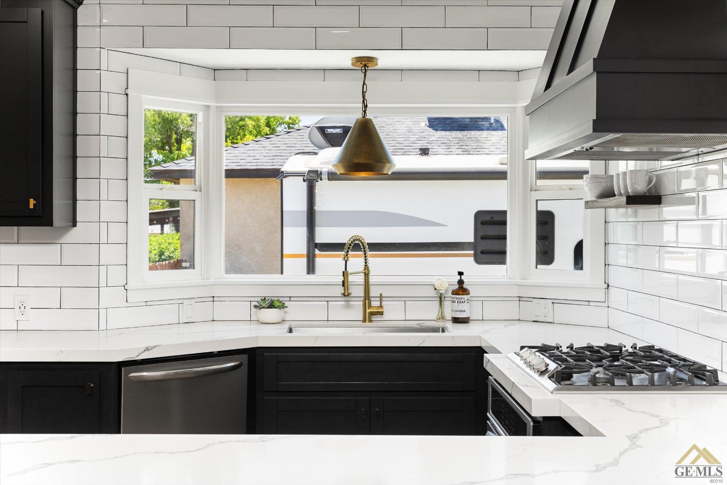 Undisclosed Address Bakersfield, CA 93305 - Photo 21 of 41 a kitchen with a sink and cabinets