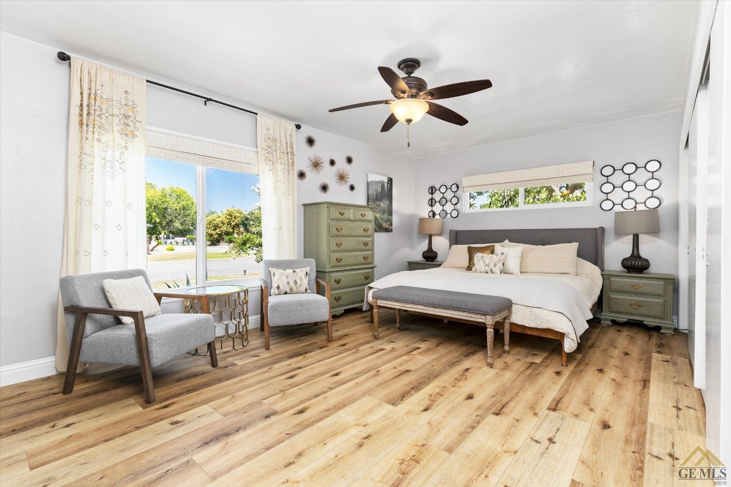 Undisclosed Address Bakersfield, CA 93305 - Photo 24 of 41 a bedroom with a bed and wooden floor