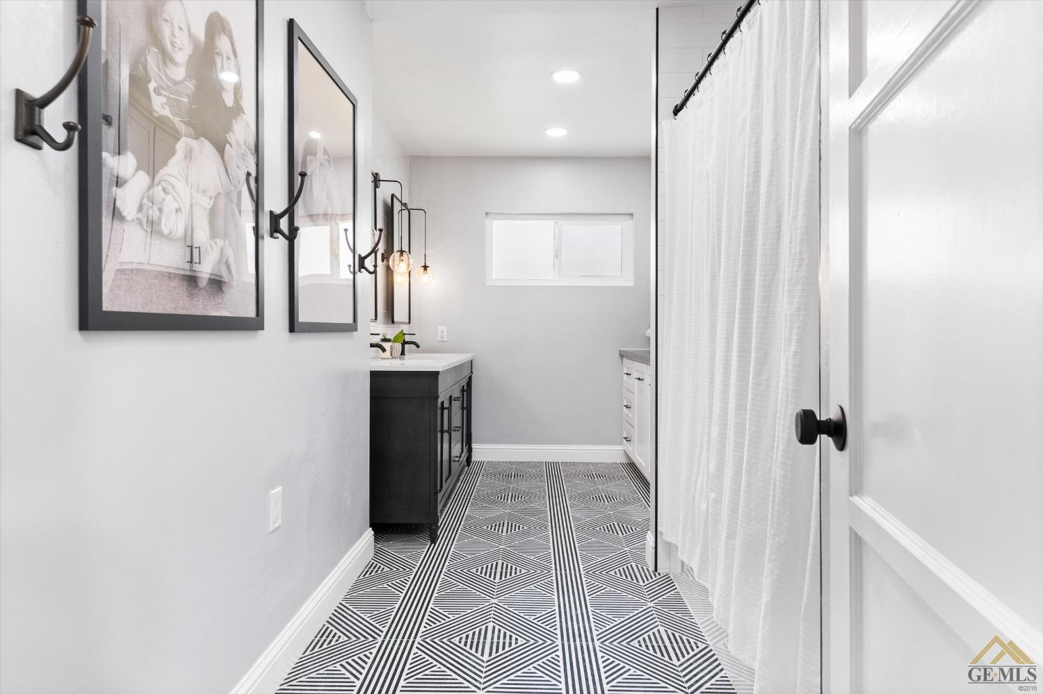Undisclosed Address Bakersfield, CA 93305 - Photo 27 of 41 a view of a hallway with wooden floor and staircase