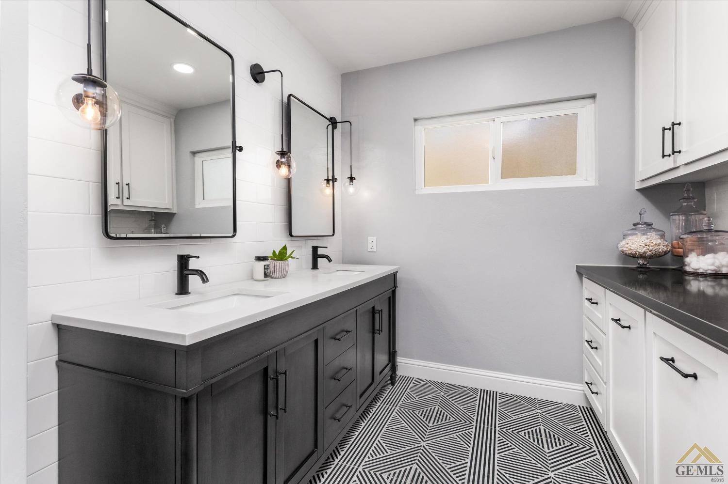 Undisclosed Address Bakersfield, CA 93305 - Photo 28 of 41 a bathroom with a sink double vanity and a mirror
