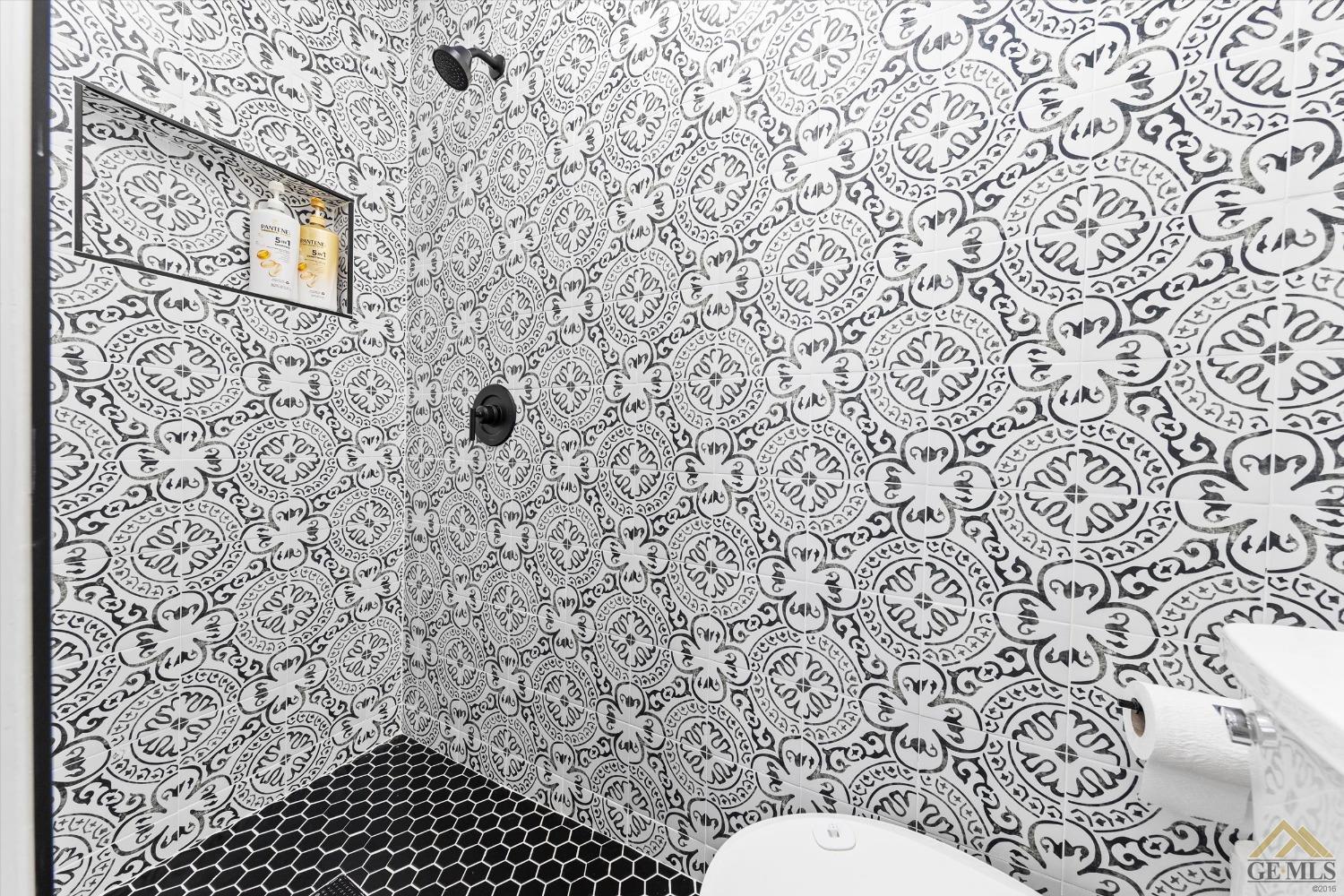 Undisclosed Address Bakersfield, CA 93305 - Photo 29 of 41 a bathroom with a toilet and a shower curtain