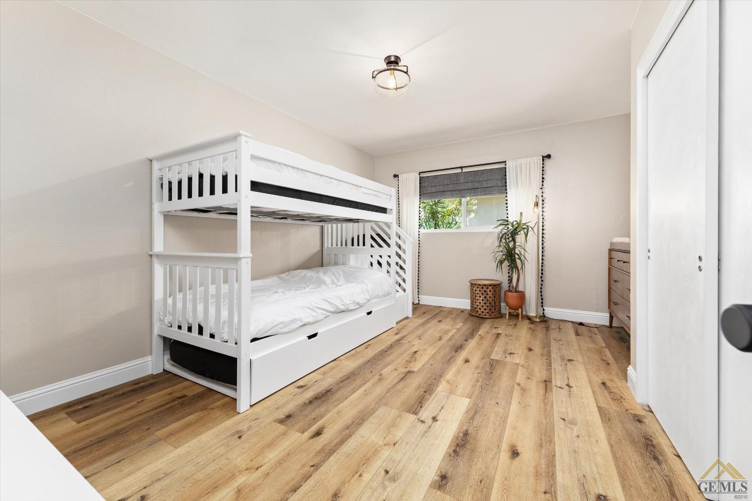 Undisclosed Address Bakersfield, CA 93305 - Photo 30 of 41 a bedroom with a bed and a window