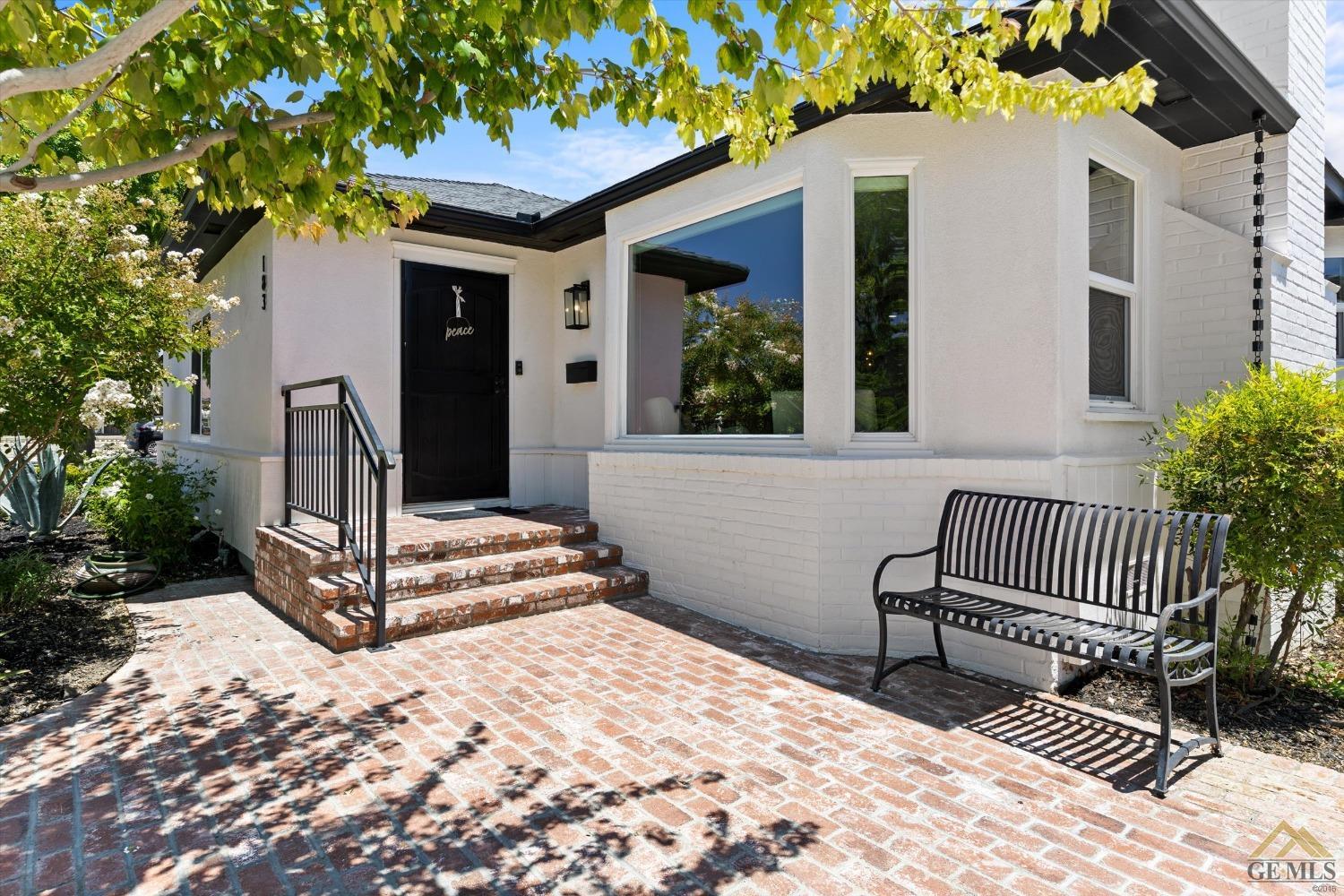 Undisclosed Address Bakersfield, CA 93305 - Photo 4 of 41 a front view of a house with garden