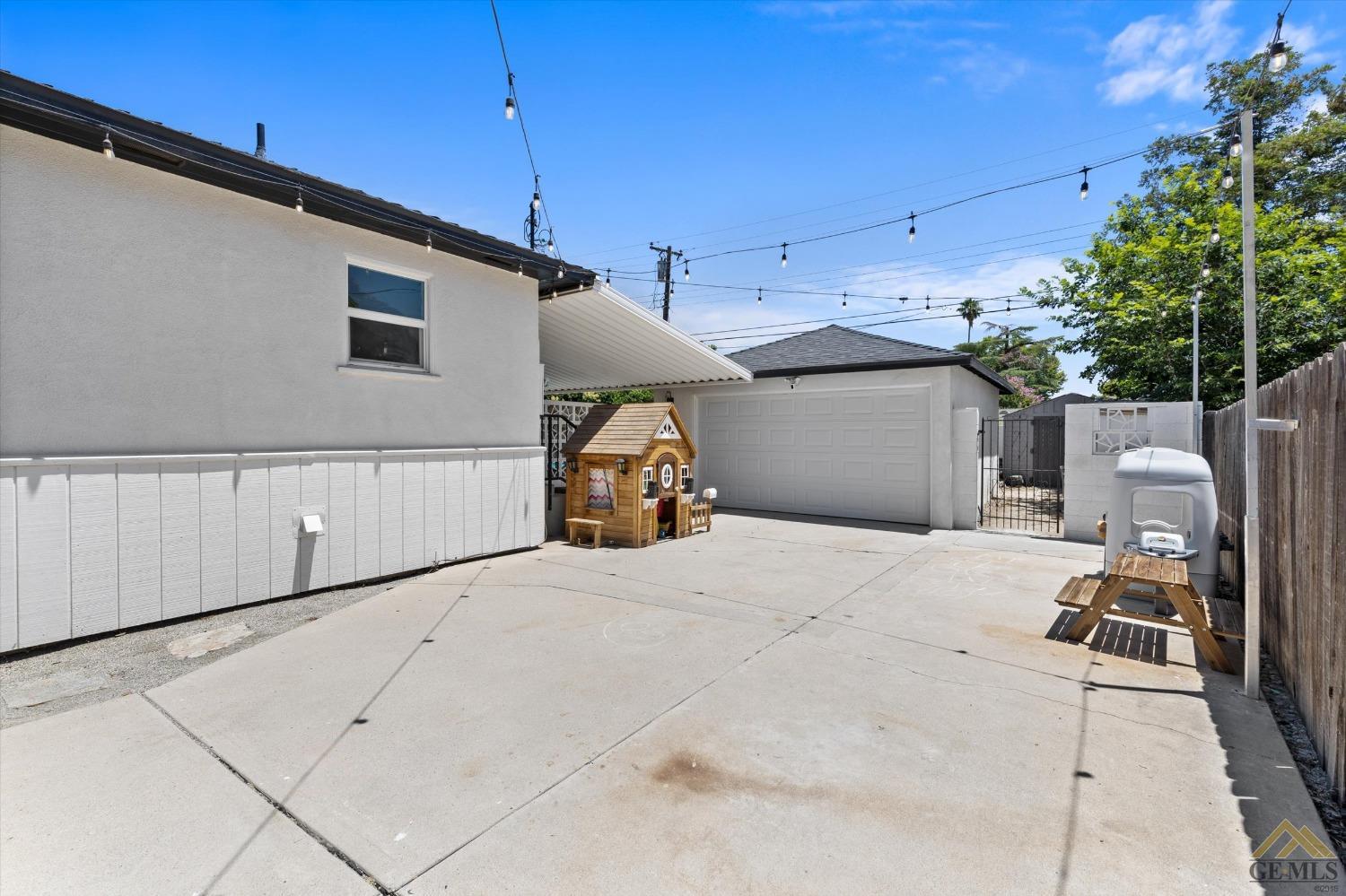 Undisclosed Address Bakersfield, CA 93305 - Photo 41 of 41 a backyard of a house with yard and outdoor seating