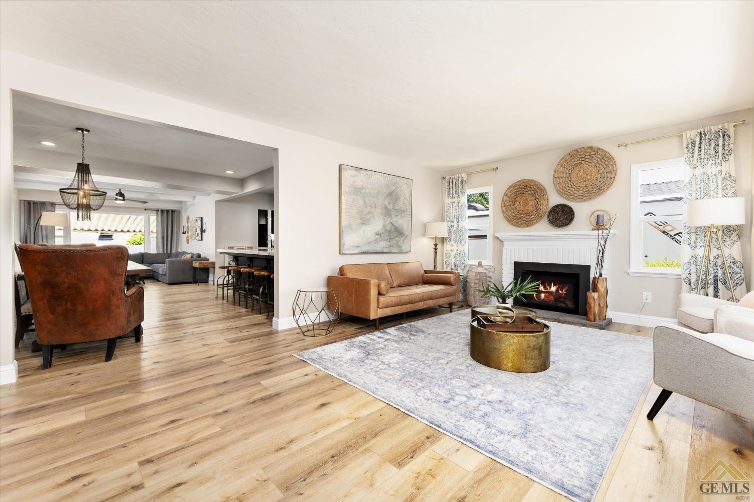 Undisclosed Address Bakersfield, CA 93305 - Photo 5 of 41 a living room with furniture and a fireplace