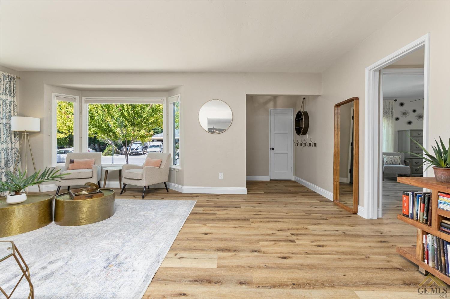 Undisclosed Address Bakersfield, CA 93305 - Photo 6 of 41 a living room with furniture window and wooden floor