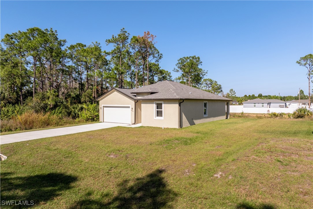 568 Woodview Drive Lehigh Acres, FL 33972 - Photo 2 of 38