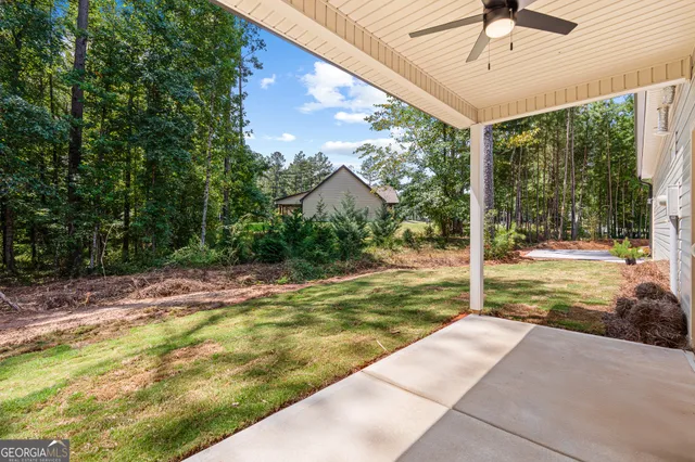 a view of a patio with a table and chairs
