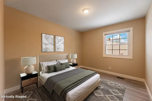 a bedroom with bed and a window