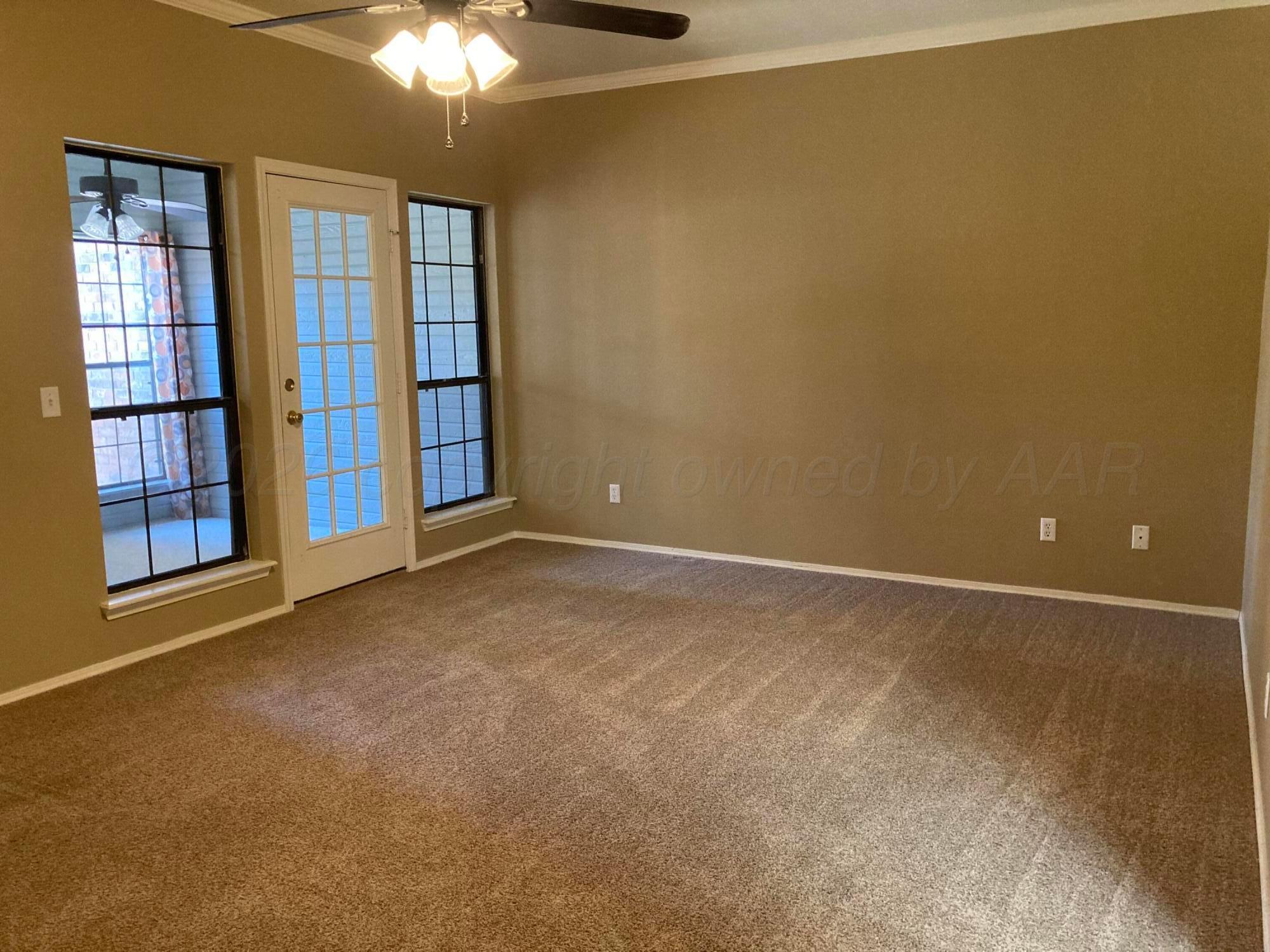 3509 West Point Drive Amarillo, TX 79121 - Photo 4 of 10 a view of an empty room with a window