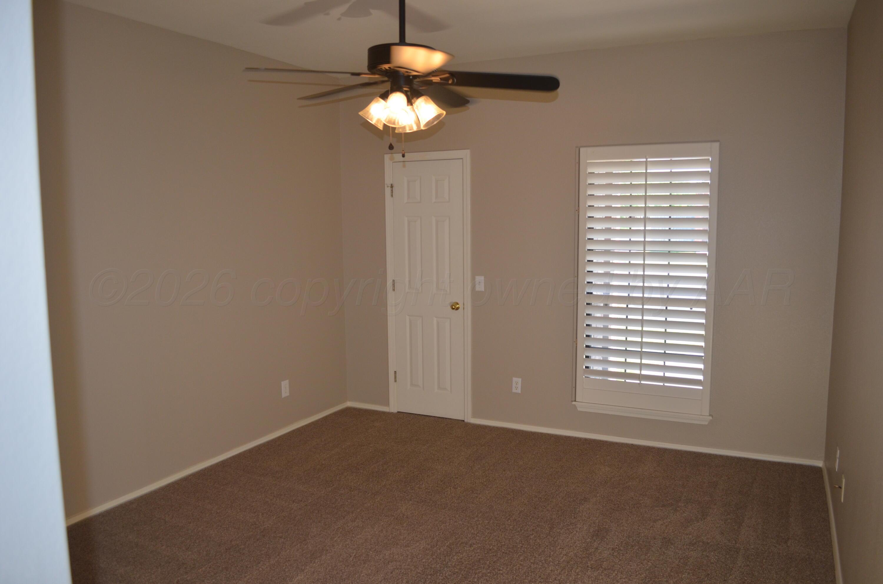 3509 West Point Drive Amarillo, TX 79121 - Photo 7 of 10 a view of an empty room with a window