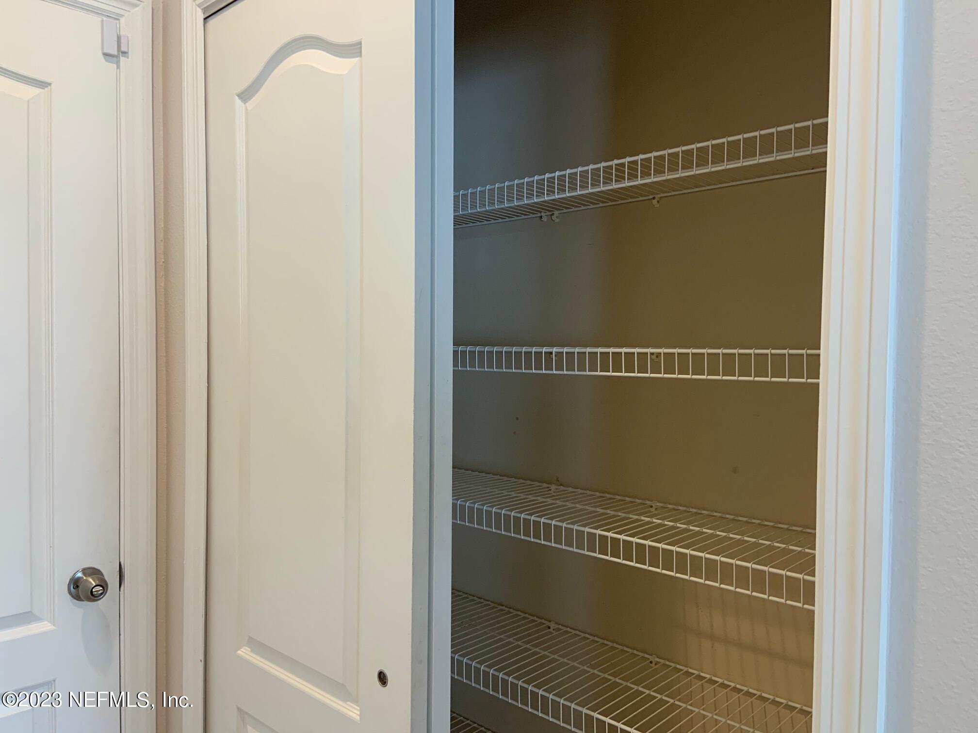 3863 Chasing Falls Road Orange Park, FL 32065 - Photo 14 of 32 a bathroom with a glass shower door