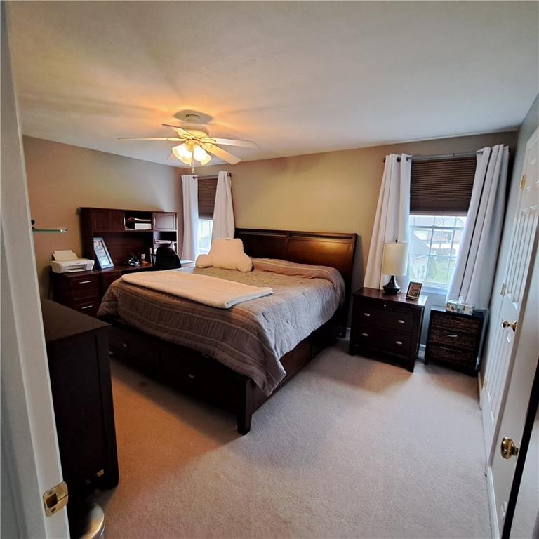 304 Acre Avenue Butler, PA 16001 - Photo 11 of 21 a bedroom with a bed and a chandelier