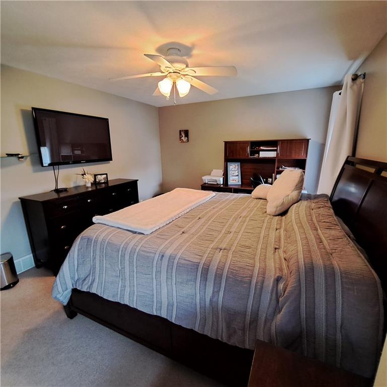 304 Acre Avenue Butler, PA 16001 - Photo 12 of 21 a bedroom with a bed and a flat screen tv
