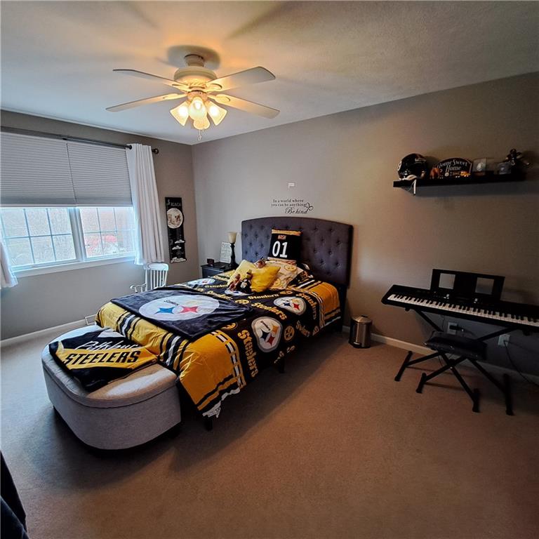 304 Acre Avenue Butler, PA 16001 - Photo 13 of 21 a bedroom with two beds and a chandelier