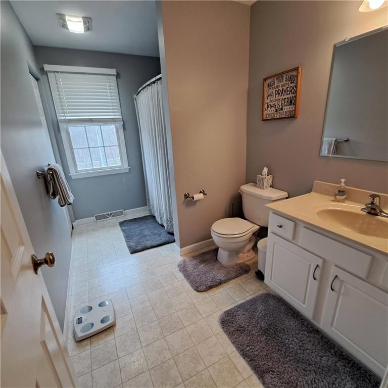 304 Acre Avenue Butler, PA 16001 - Photo 15 of 21 a bathroom with a sink toilet and shower