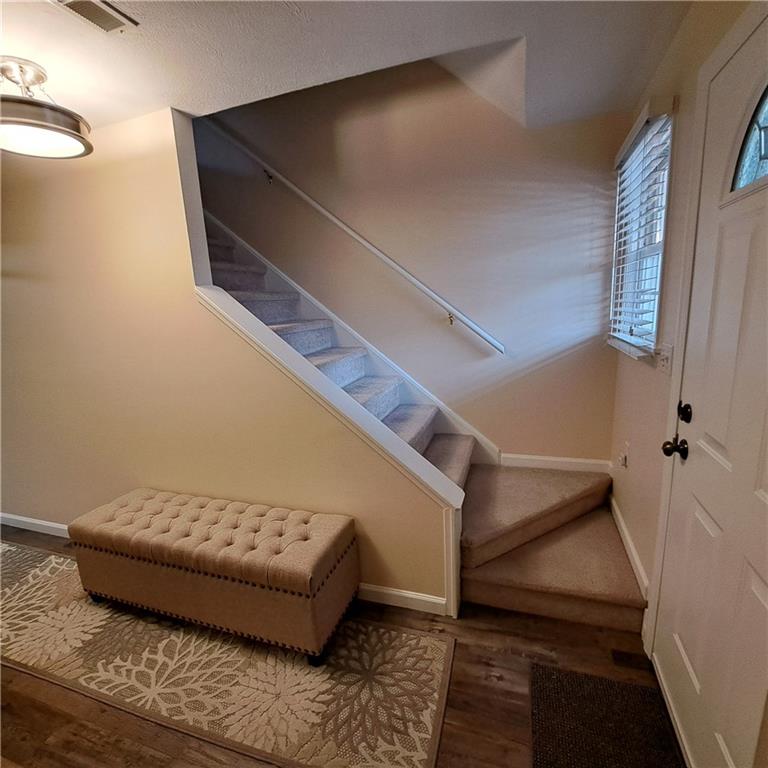 304 Acre Avenue Butler, PA 16001 - Photo 17 of 21 a living room with furniture and stairs