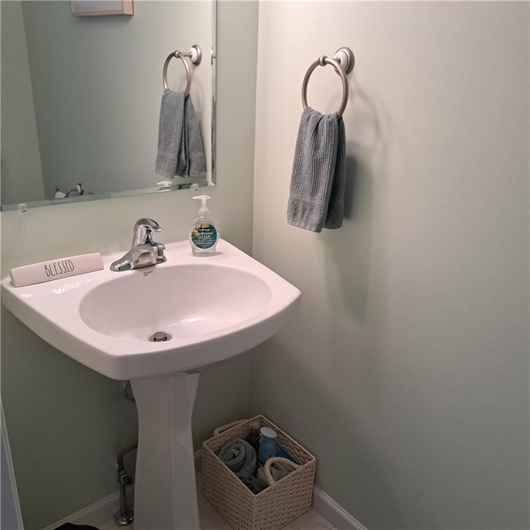 304 Acre Avenue Butler, PA 16001 - Photo 10 of 21 a bathroom with a sink and a mirror