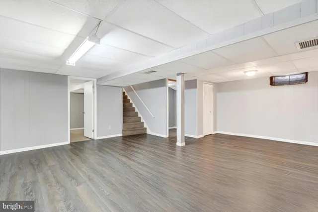 a bathroom with a sink a toilet and a shower