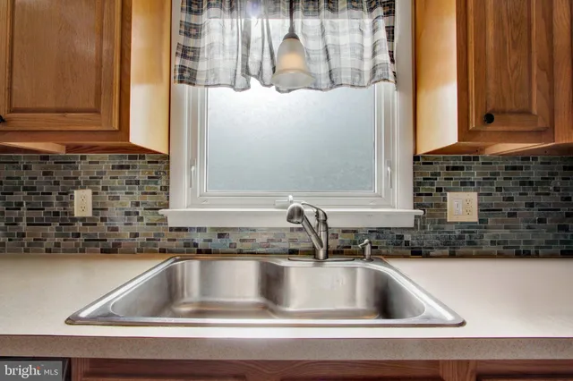 a kitchen with a table and chairs in it
