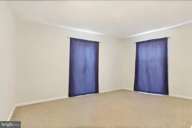 a bedroom with bed and a couch