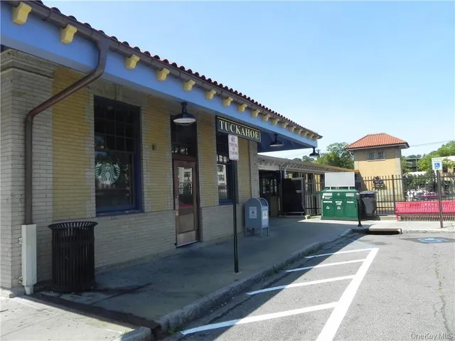 a view of a building with sitting area