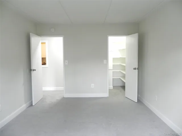 a view of staircase with empty racks