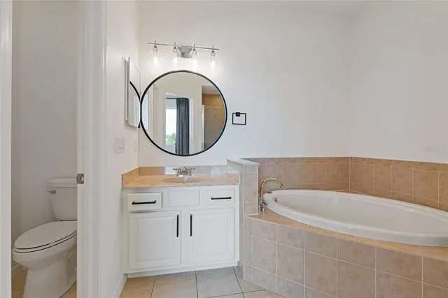 a bathroom with a sink a mirror and a shower