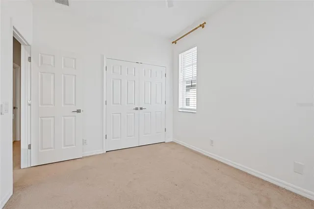 a bathroom with a granite countertop sink toilet a mirror and shower