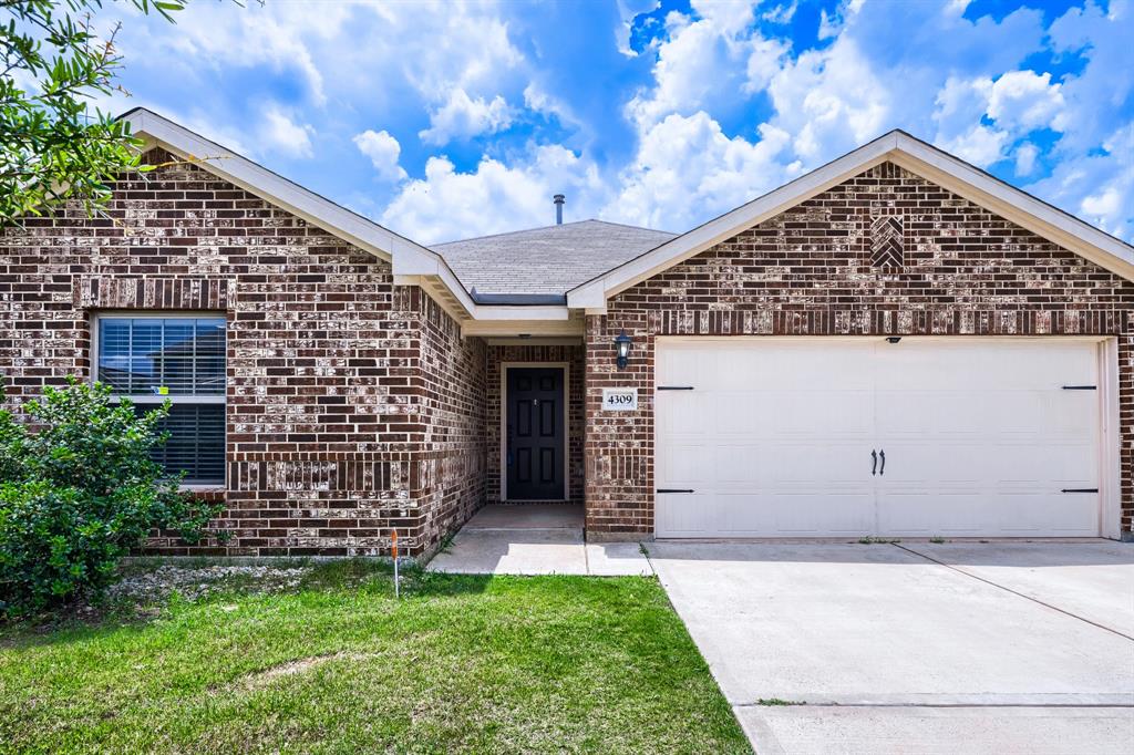 4309 Cat Tail Way Forney, TX 75126 - Photo 3 of 30 Brick exterior residence featuring an attached two-car garage, concrete driveway, and a covered entry