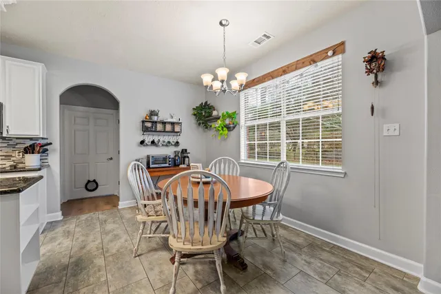 a view of a dining room with furniture window and outside view
