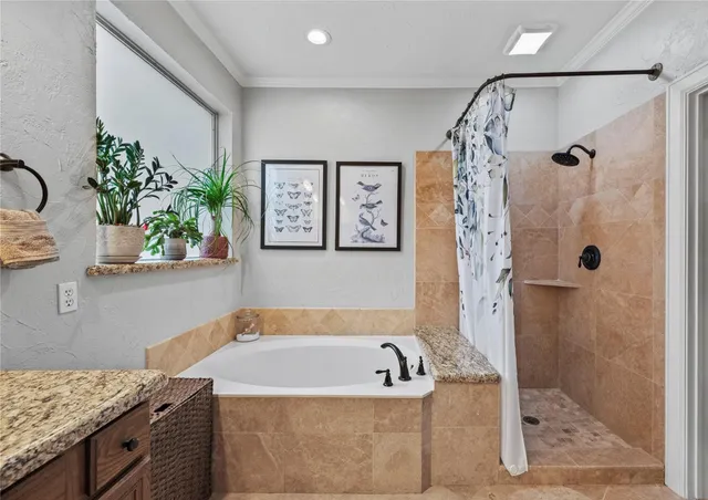 a room with gym equipment and a chandelier