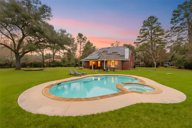 a view of swimming pool with outdoor seating