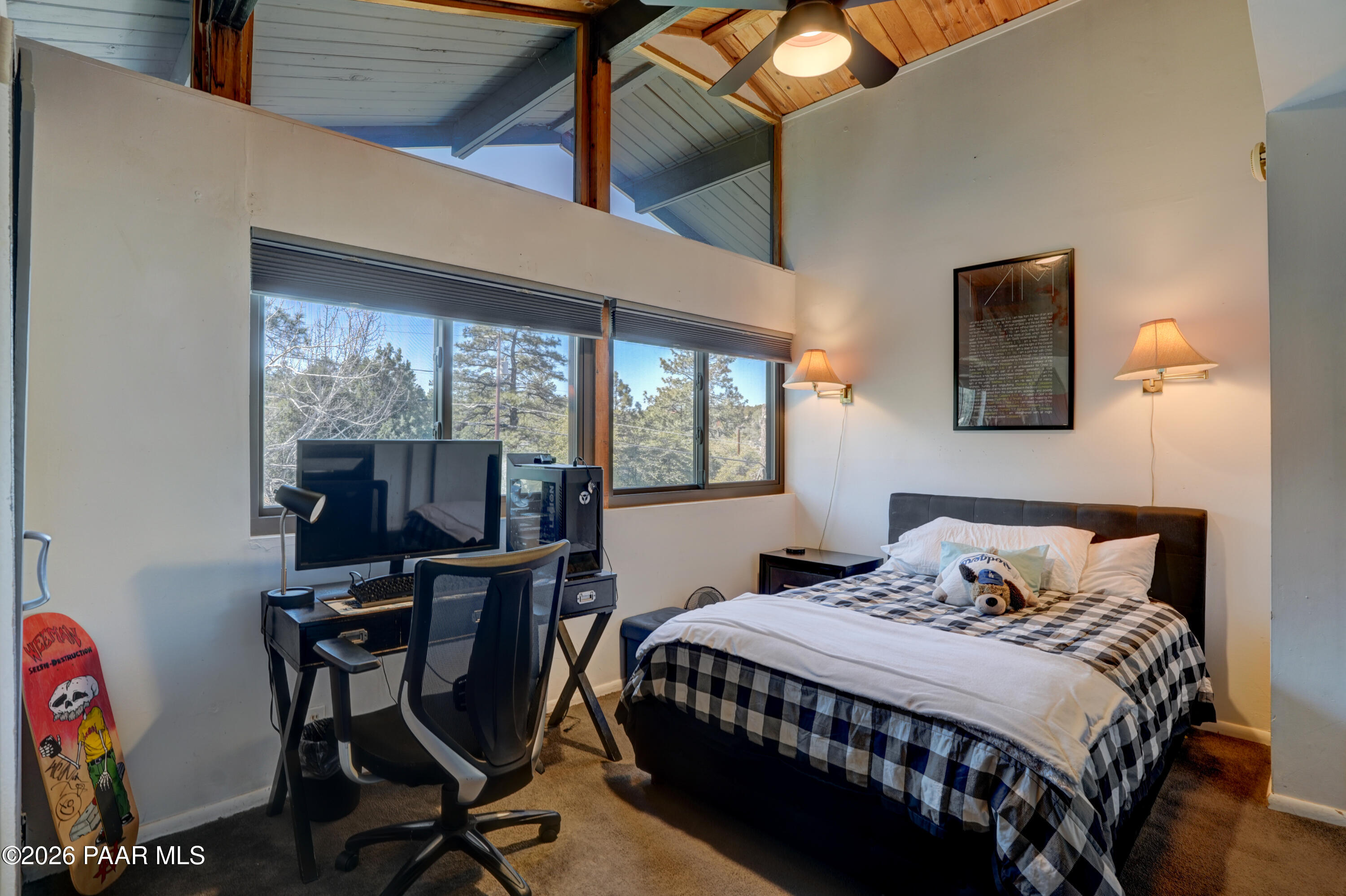 1963 Idylwild Road Prescott, AZ 86305 - Photo 19 of 54 a bedroom with a bed a desk and chair with the wooden floor