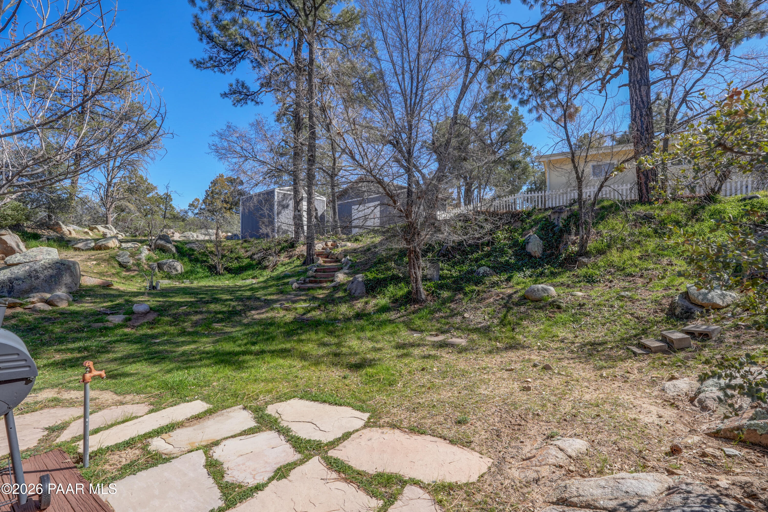 1963 Idylwild Road Prescott, AZ 86305 - Photo 33 of 54 a backyard of a house with lots of green space
