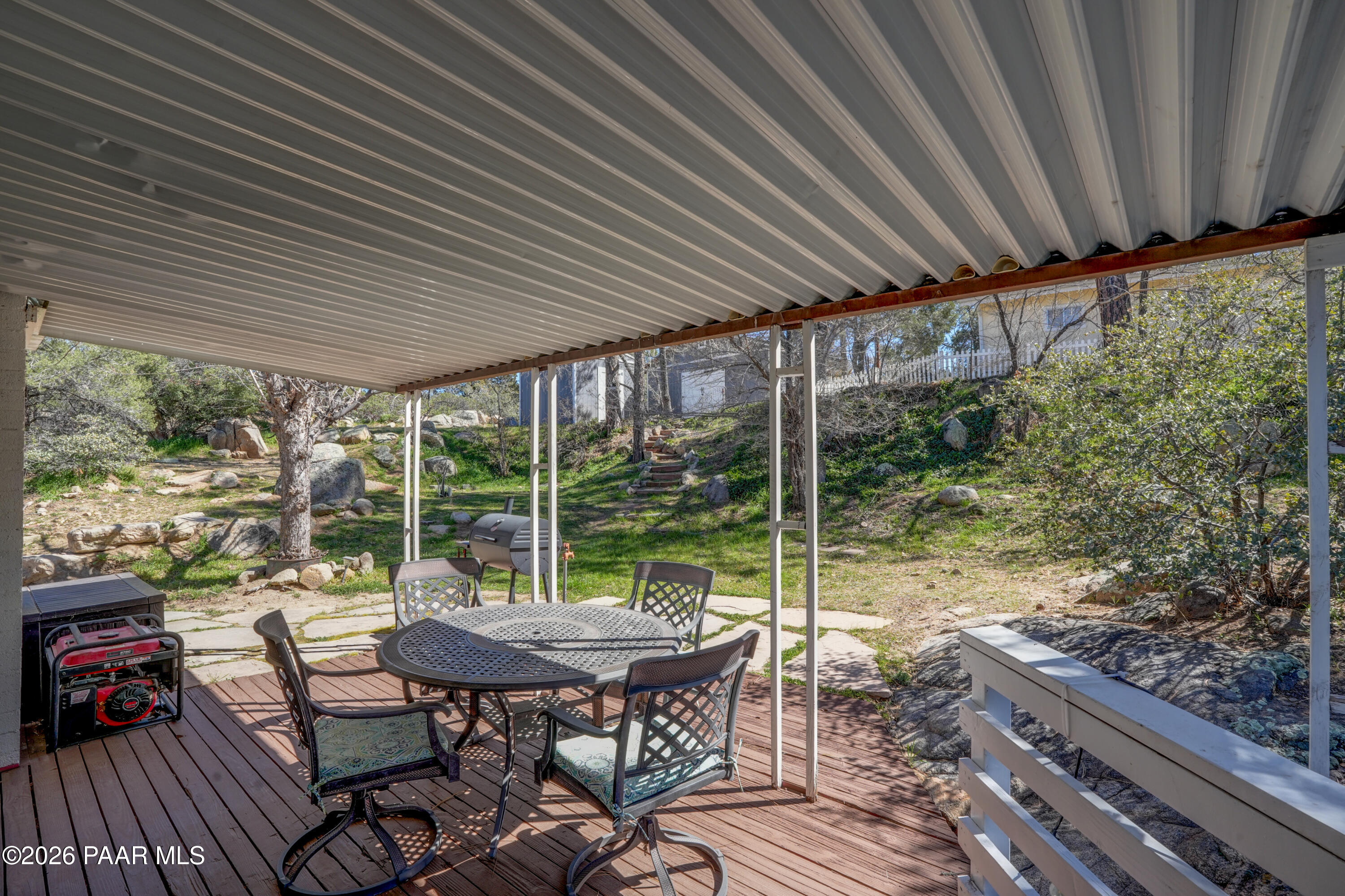 1963 Idylwild Road Prescott, AZ 86305 - Photo 40 of 54 a view of a patio with table and chairs and wooden floor