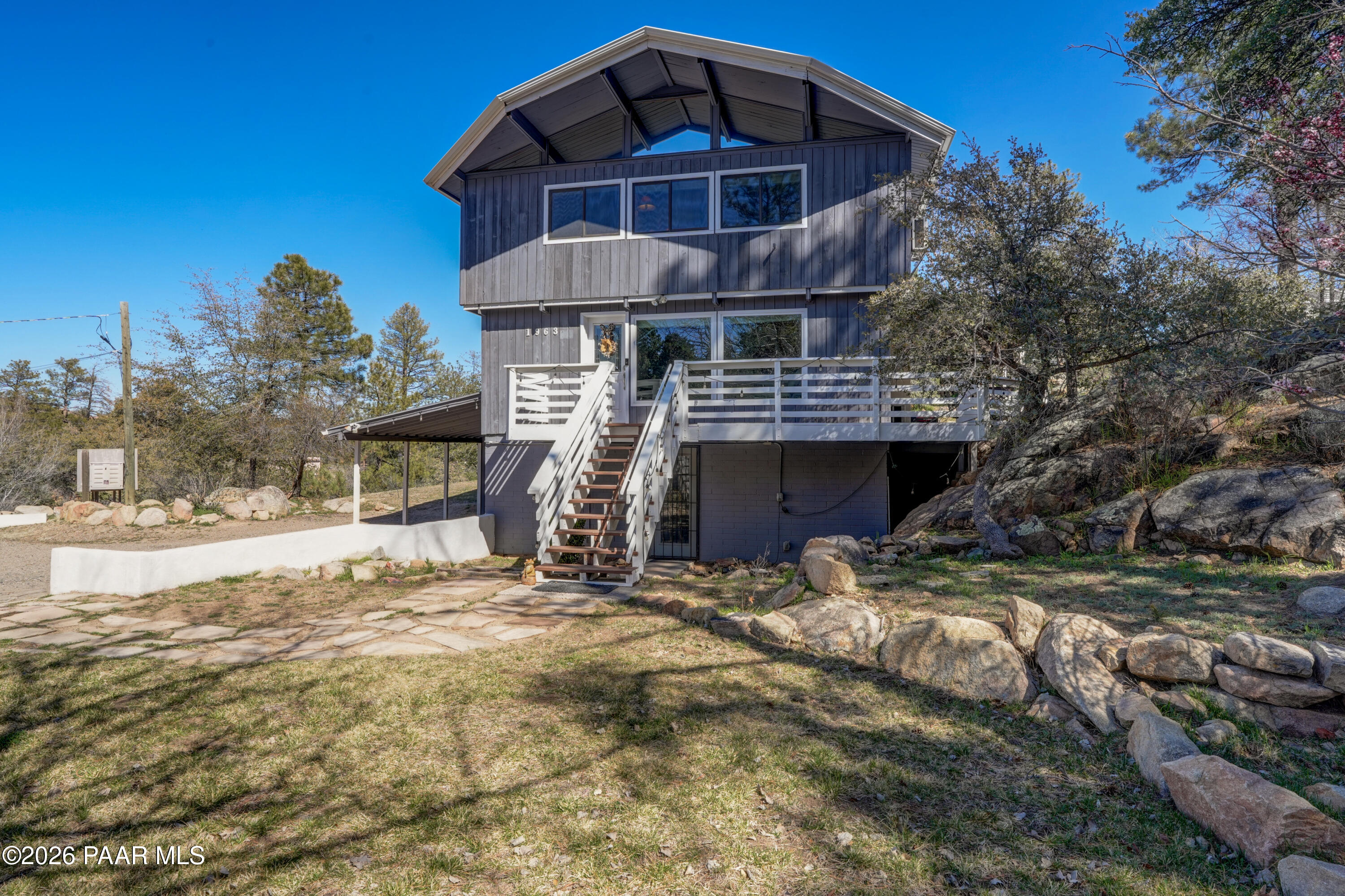 1963 Idylwild Road Prescott, AZ 86305 - Photo 41 of 54 a view of a house with a yard and wooden fence