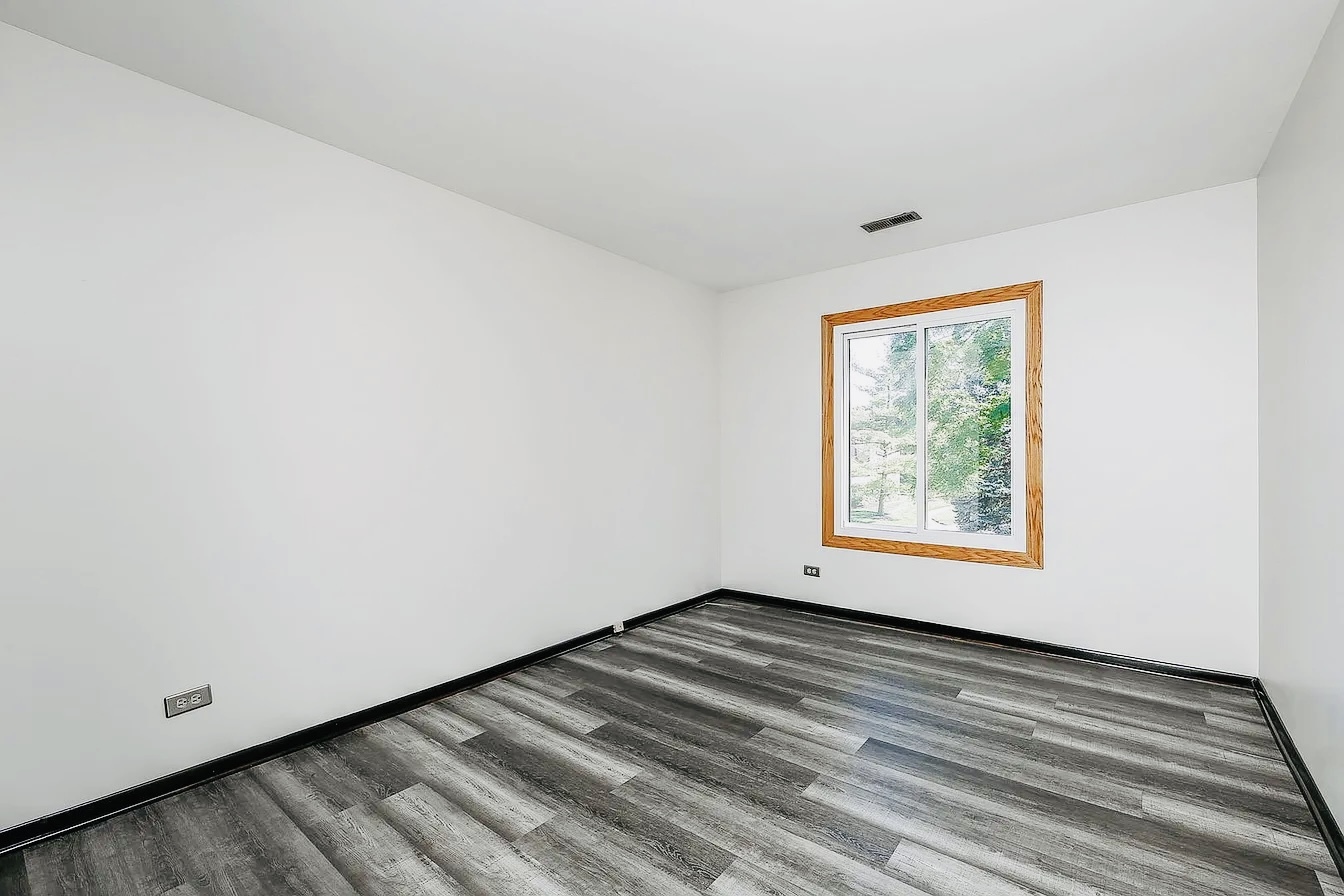 865 Sheldon Court, Unit C Wheaton, IL 60189 - Photo 9 of 11 a view of an empty room with a window