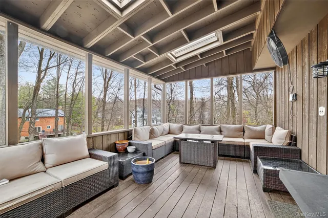 a view of a kitchen with a sink and a refrigerator