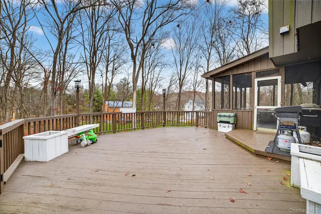 a view of a bench in backyard of house