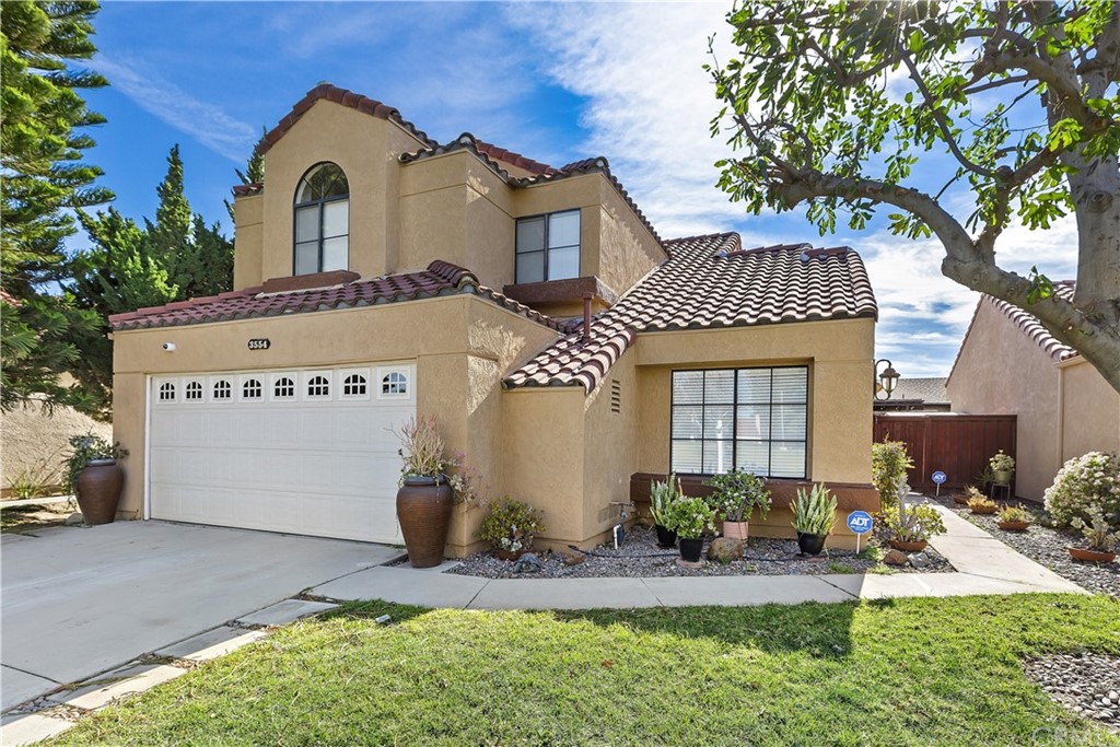 3554 Atchison Circle Riverside, CA 92503 - Photo 1 of 1 a front view of a house with garden