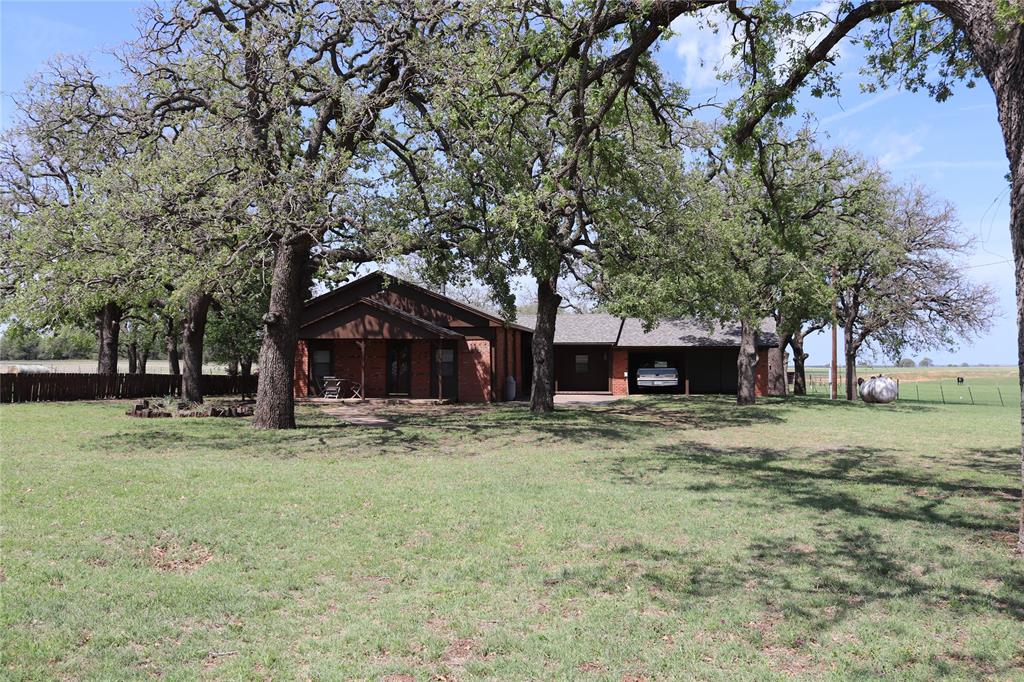 a house with trees in the background