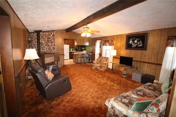 a living room with furniture and a rug