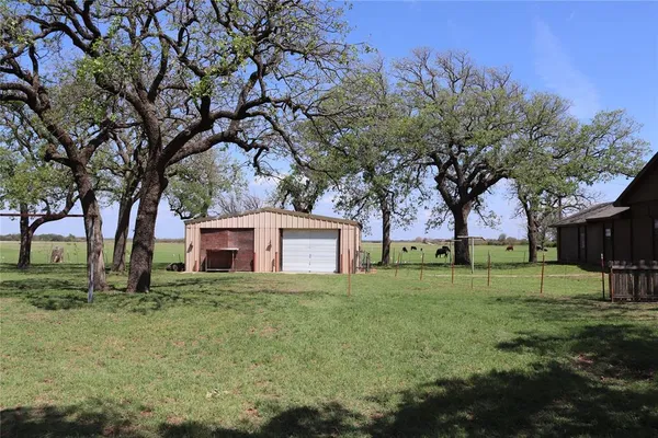 a house that has a tree in front of it