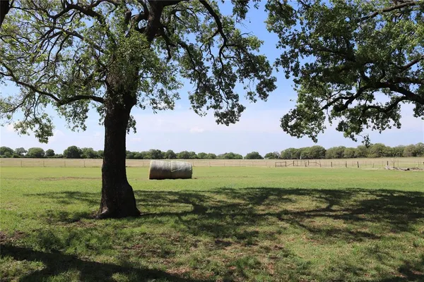 a view of a lake with a big yard