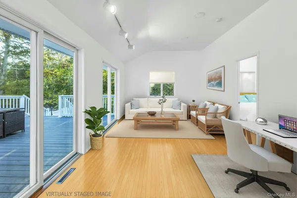 a living room with furniture and a table