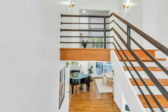 a view of entryway and hall with wooden floor